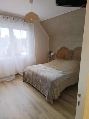 Un ou plusieurs lits dans un hébergement de l'établissement La Vallée Appartement Proche du Mont Saint Michel