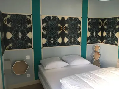 Un ou plusieurs lits dans un hébergement de l'établissement Maison face mer à Pirou Plage