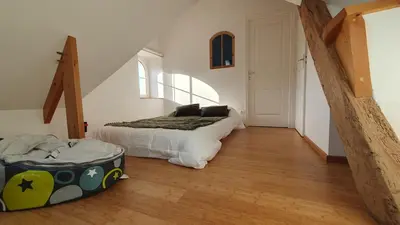 Un ou plusieurs lits dans un hébergement de l'établissement appartement du croissant