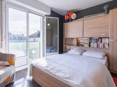 Un ou plusieurs lits dans un hébergement de l'établissement Apartment Les Dunes by Interhome