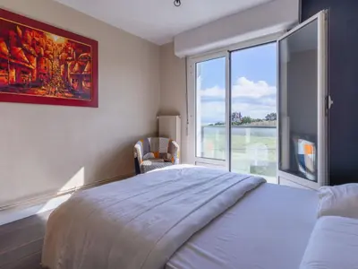 Un ou plusieurs lits dans un hébergement de l'établissement Apartment Les Dunes by Interhome