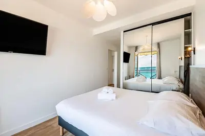 Un ou plusieurs lits dans un hébergement de l'établissement Les Pieds Dans L'Eau - Appartements 1 et 2 - Vue mer