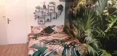 Un ou plusieurs lits dans un hébergement de l'établissement Le jardin d'Eden