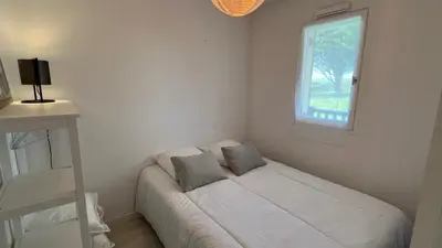 Un ou plusieurs lits dans un hébergement de l'établissement Appartement 2 pièces en rez-de-chaussée dans résidence avec accès direct à la plage