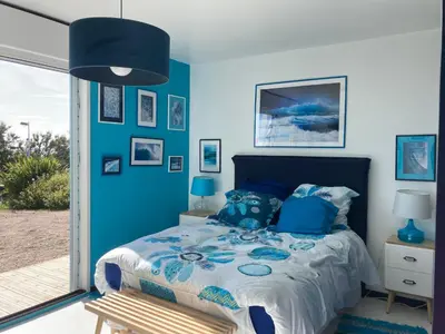 Un ou plusieurs lits dans un hébergement de l'établissement La Maison Bleue-Sciotot-Les Pieux