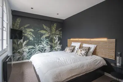 Un ou plusieurs lits dans un hébergement de l'établissement Villa MaRisKa et son Spa, avec balcon