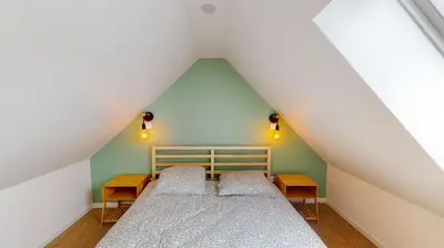 Un ou plusieurs lits dans un hébergement de l'établissement Charmante Maison en Pierre - Centre Ville - Plage