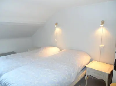 Un ou plusieurs lits dans un hébergement de l'établissement Cabourg éventail 3min à pied de la plage