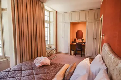 Un ou plusieurs lits dans un hébergement de l'établissement Château Hôtel - Domaine de Coeurmandie
