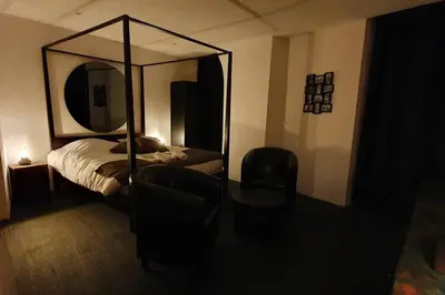 Un ou plusieurs lits dans un hébergement de l'établissement Bayeuzen - Le Baldaquin - Nuitée avec Spa Privatif