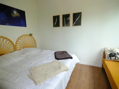 Un ou plusieurs lits dans un hébergement de l'établissement Le beaupré loft vue mer imprenable