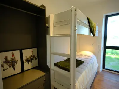 Un ou plusieurs lits dans un hébergement de l'établissement Le beaupré loft vue mer imprenable