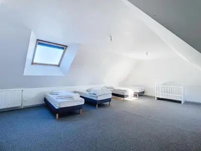 Coin salon dans l'établissement Grande maison de vacances