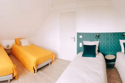 Un ou plusieurs lits dans un hébergement de l'établissement Villa Mon Rêve 12 pers à 500m de la plage