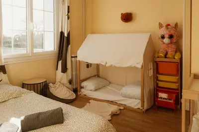 Un ou plusieurs lits dans un hébergement de l'établissement Maison Plage Adouda