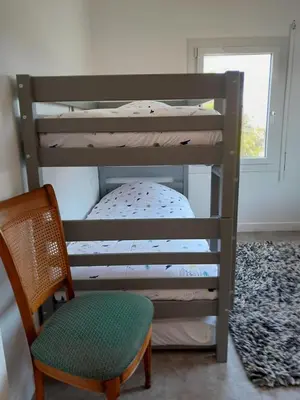 Un ou plusieurs lits dans un hébergement de l'établissement Maison de vacances Bréhal