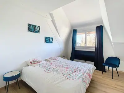 Un ou plusieurs lits dans un hébergement de l'établissement Maison de vacances en famille