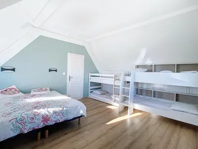 Un ou plusieurs lits dans un hébergement de l'établissement Maison de vacances en famille