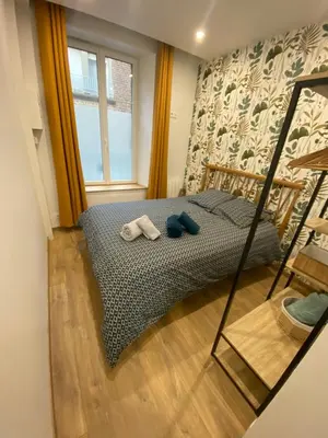 Un ou plusieurs lits dans un hébergement de l'établissement Joli appartement F2 plein centre Coutances