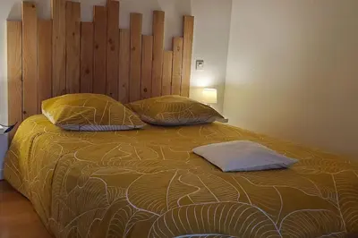 Un ou plusieurs lits dans un hébergement de l'établissement La Team Familly Vue sur le Mont St Michel