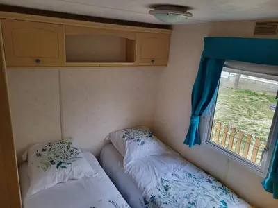 Un ou plusieurs lits dans un hébergement de l'établissement Mobil Home à la ferme