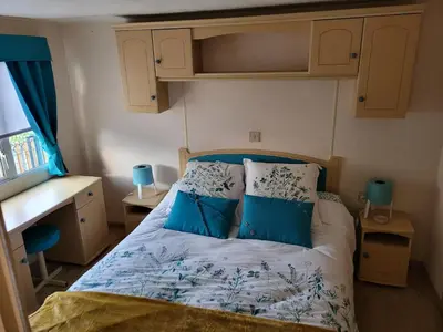 Un ou plusieurs lits dans un hébergement de l'établissement Mobil Home à la ferme