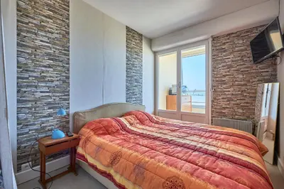 Un ou plusieurs lits dans un hébergement de l'établissement La Longue Vue - Appt face à la mer