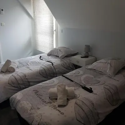 Un ou plusieurs lits dans un hébergement de l'établissement Entre Caen et la mer avec Piscine