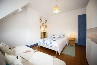 Un ou plusieurs lits dans un hébergement de l'établissement Villa Quiné Plage