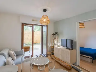 Télévision ou salle de divertissement dans l'établissement Apartment Cabourg Plage-21 by Interhome