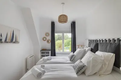 Un ou plusieurs lits dans un hébergement de l'établissement La Maison de Louise - Superbe maison avec patio
