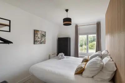 Un ou plusieurs lits dans un hébergement de l'établissement La Maison de Louise - Superbe maison avec patio