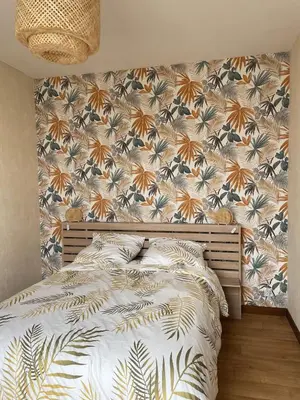 Un ou plusieurs lits dans un hébergement de l'établissement Appartement 35 m2 1er étage 200 m de la mer avec jardin