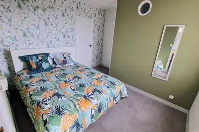 Un ou plusieurs lits dans un hébergement de l'établissement Appartement Ouistreham proche centre et plage