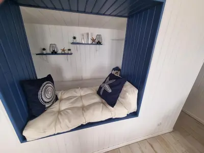 Un ou plusieurs lits dans un hébergement de l'établissement Petite maison avec jardin face mer