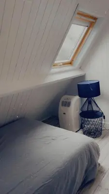 Un ou plusieurs lits dans un hébergement de l'établissement Chalet rénové Cabourg