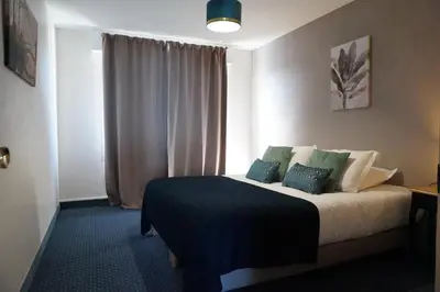 Un ou plusieurs lits dans un hébergement de l'établissement BELLE VIE vue dominante mer et plage - Appartement 2 à 4 personnes