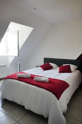 Un ou plusieurs lits dans un hébergement de l'établissement Détente cosy