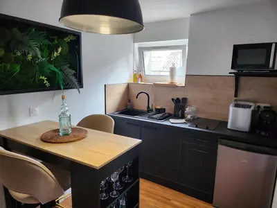 Cuisine ou kitchenette dans l'établissement Caen, Tu m'aimes - Suite Romantique