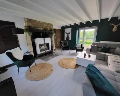 Coin salon dans l'établissement Gîte 200m2 avec spa