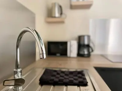 Cuisine ou kitchenette dans l'établissement Le Liberty by Melrose
