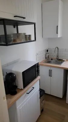 Cuisine ou kitchenette dans l'établissement La Pause Valognaise 