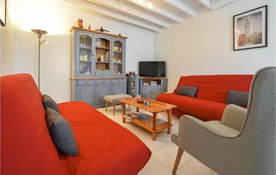 Télévision ou salle de divertissement dans l'établissement La Maison Du Dy