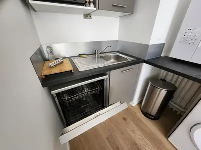 Cuisine ou kitchenette dans l'établissement Le Quai des Bleus