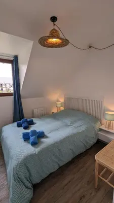 Un ou plusieurs lits dans un hébergement de l'établissement Cottage Cabourg plage avec jardin et vélos