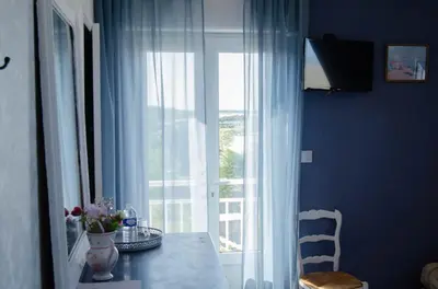 Télévision ou salle de divertissement dans l'établissement Villa les Dunes
