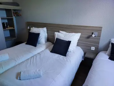 Un ou plusieurs lits dans un hébergement de l'établissement Hotel Eisenhower