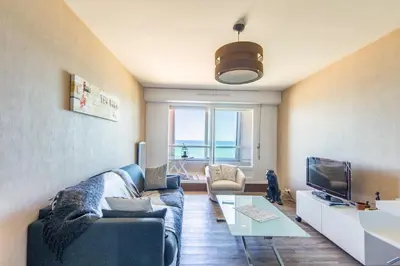 Télévision ou salle de divertissement dans l'établissement La Vue Marine - Appartement vue mer