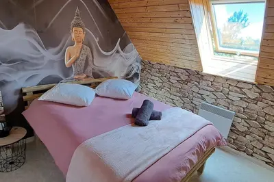 Un ou plusieurs lits dans un hébergement de l'établissement Cottage La loge