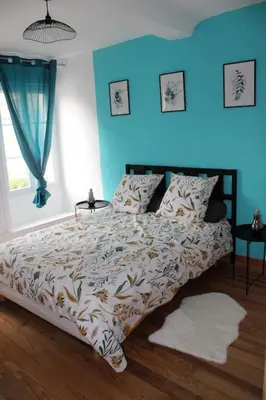 Un ou plusieurs lits dans un hébergement de l'établissement Koh'm à la maison